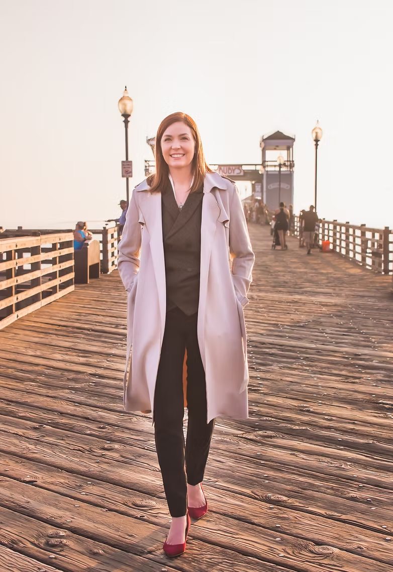 April Durrant walking on the Oceanside pier at sunset